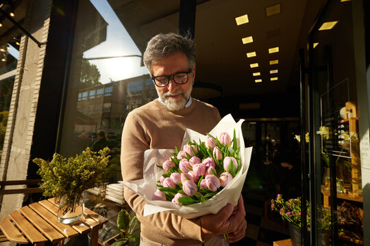 Man bought a bouquet of flowers