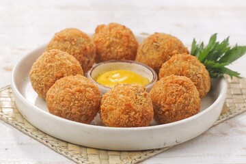 Bitterballen is the name of a type of food in the Netherlands. Bitterballen taste similar to croquettes, but are small round shapes about 3 to 4 cm