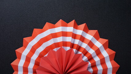 Independence Day Indonesia banner mockup with Indonesia flag color paper fan isolated on black background