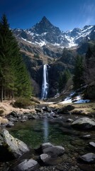 Obraz premium Mountain waterfall reflecting in tranquil pool