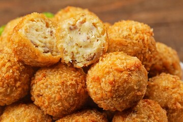 Bitterballen is the name of a type of food in the Netherlands. Bitterballen taste similar to croquettes, but are small round shapes about 3 to 4 cm