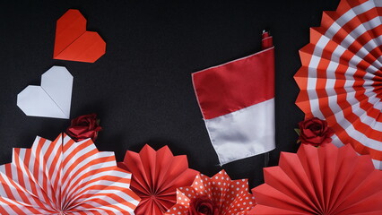 Independence Day Indonesia banner mockup with flag decoration and Indonesia flag color paper fans isolated on black background