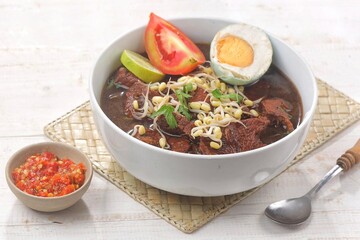 Rawon is a typical Indonesian dish originating from Ponorogo, East Java, which is a black meat soup with a mixture of special spices using kluwek.