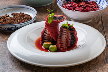 Lotus root slices stuffed with red wine and black sesame