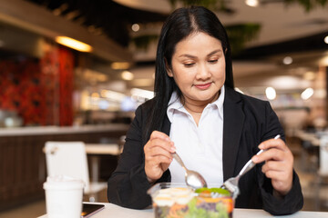 Woman eating salad