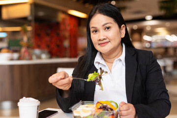 Woman eating salad