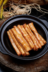 Pan-baked iron stick long yam placed on camphorwood chopping board