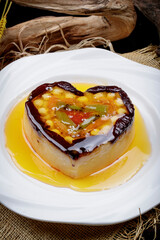 Wedding dessert glutinous rice eight-treasure rice pudding on a white porcelain plate