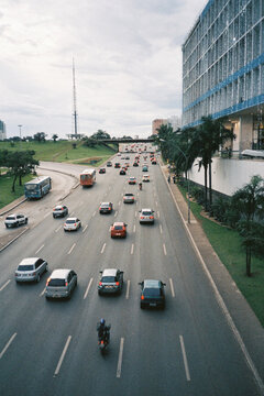 Busy Urban Highway with Traffic and Modern Buildings