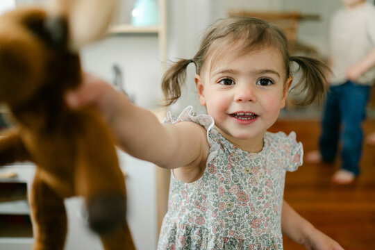 portrait of smiling little girl with pigtails 