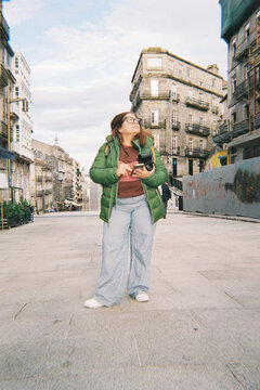 Tourist Woman Exploring Historic City Street
