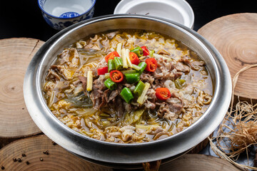 Sour lamb soup in stainless steel cutlery