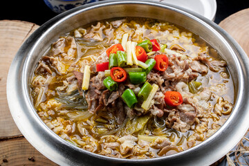Sour lamb soup in stainless steel cutlery