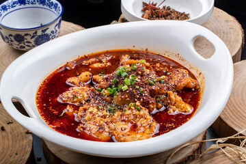 Spicy boiled beef in blue and white porcelain plate