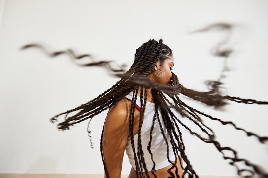Portrait of a dancer showcasing beautiful braided hair in motion