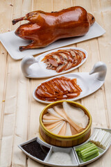 Peking duck on wooden board in sauna