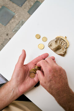 Retired Man Counting Euro Coins