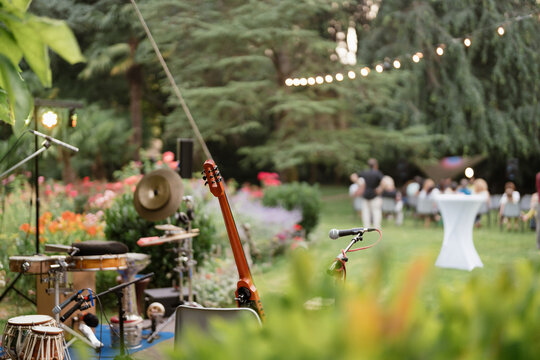 Musical instruments on a stage in a garden 