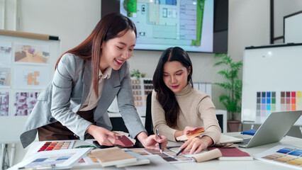 Asian Interior Designers Collaborate on Color Palette Selection for Modern Home Renovation Project Interior Design Solutions and Creative Teamwork