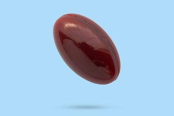 Medicine pill soft gel capsule float on blue background