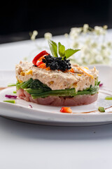 Two-flavored tuna on a white porcelain plate