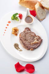 Angus sirloin steak on a white porcelain plate