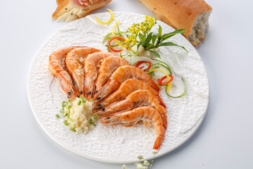 White porcelain plate with garlic-flavored South American shrimp