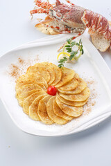Grilled potato chips on a white porcelain plate