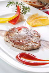 Australian steak served on a grill with red wine sauce