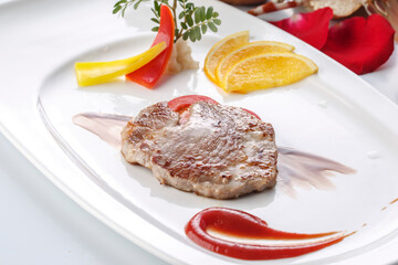 Australian steak served on a grill with red wine sauce