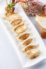 Grilled dumplings served on a plate