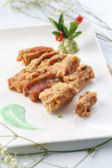 Fried pork belly in exquisite tableware