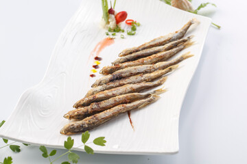 French style sizzling salt and pepper capelin served in exquisite tableware