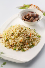 French-style iron plate fried rice with assorted vegetables served in exquisite tableware
