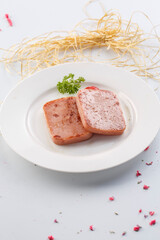 Grilled salt and pepper luncheon meat in exquisite tableware