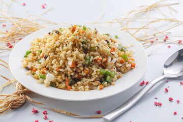 Sizzling shrimp fried rice on a straw mat