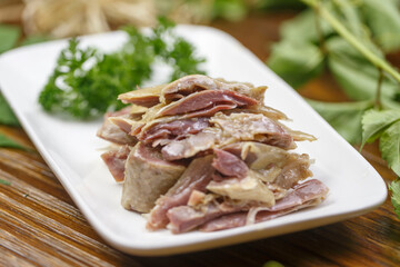 Salted chicken in an oval white porcelain plate