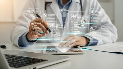 Doctor using tablet with digital medical interface and laptop on desk in a bright office - Powered by Adobe