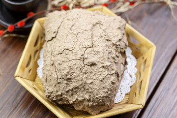 Traditional beggar's chicken in a hexagonal bamboo basket