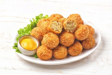 Bitterballen is the name of a type of food in the Netherlands. Bitterballen taste similar to croquettes, but are small round shapes about 3 to 4 cm