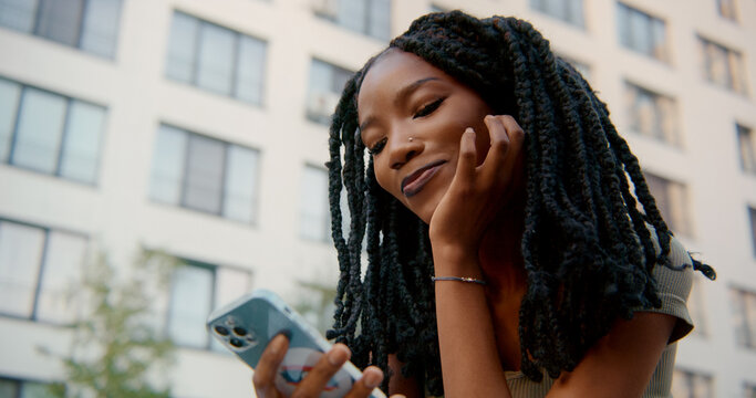 Young woman using smartphone , reading news