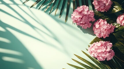 Pastel pink hydrangeas and palm leaves