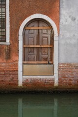Rustic Door and Pigeon by Venetian Canal