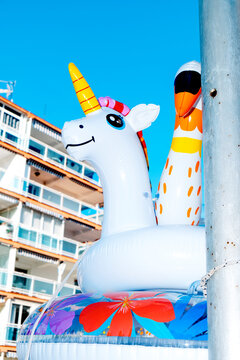 inflatable unicorn in front of an apartment complex