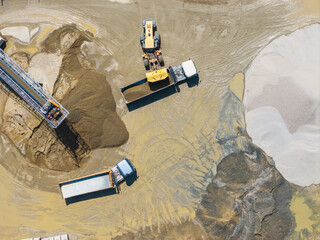 Aerial View of Trucks and Loaders at Worksite