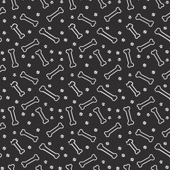 A seamless pattern featuring white outlines of bones and paw prints on a dark gray or black background. The bones are elongated and stylized, while the paw prints are small and scattered between them.