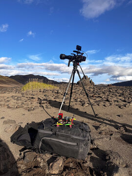 Cinematic camera and FPV drone in rocky desert