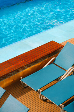 Colorful Lounge Chairs Beside Swimming Pool