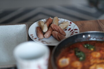 Plate of Grilled Sausages on Table