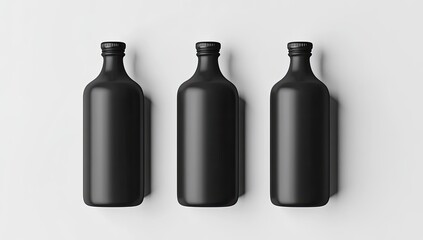 Three matte black bottles on a white surface